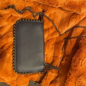Blue crossbody with detachable chain. Brand new with tag.